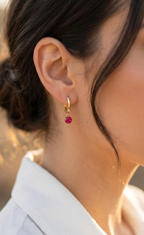 Arete punto de luz fucsia